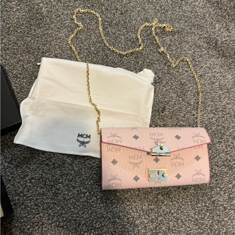 MCM Pink Crossbody Bag with Flap Closure and Gold Chain Strap